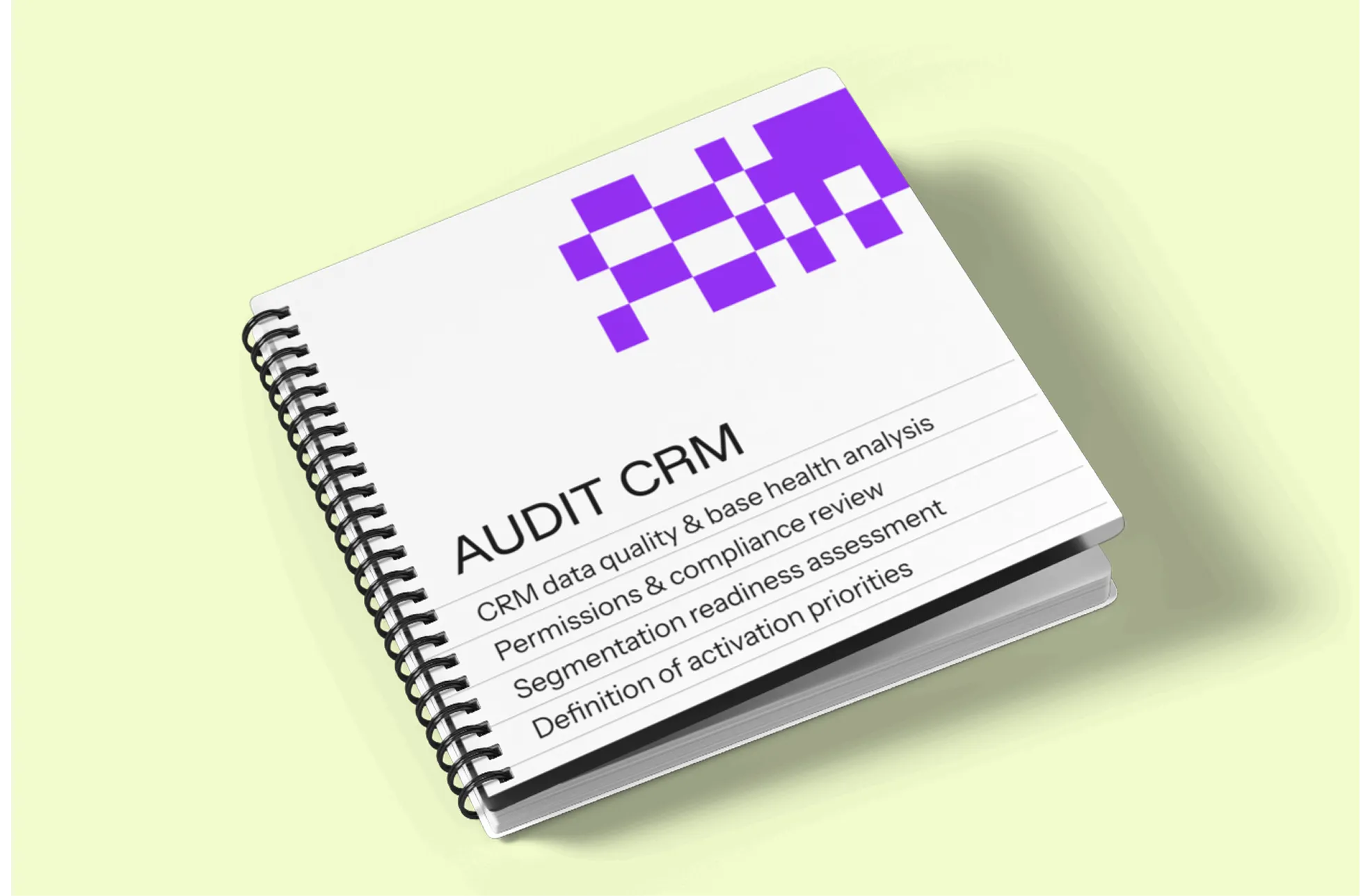 Spiral-bound notebook titled 'AUDIT CRM' listing CRM data quality, permissions review, segmentation assessment, and activation priorities on a light green background.