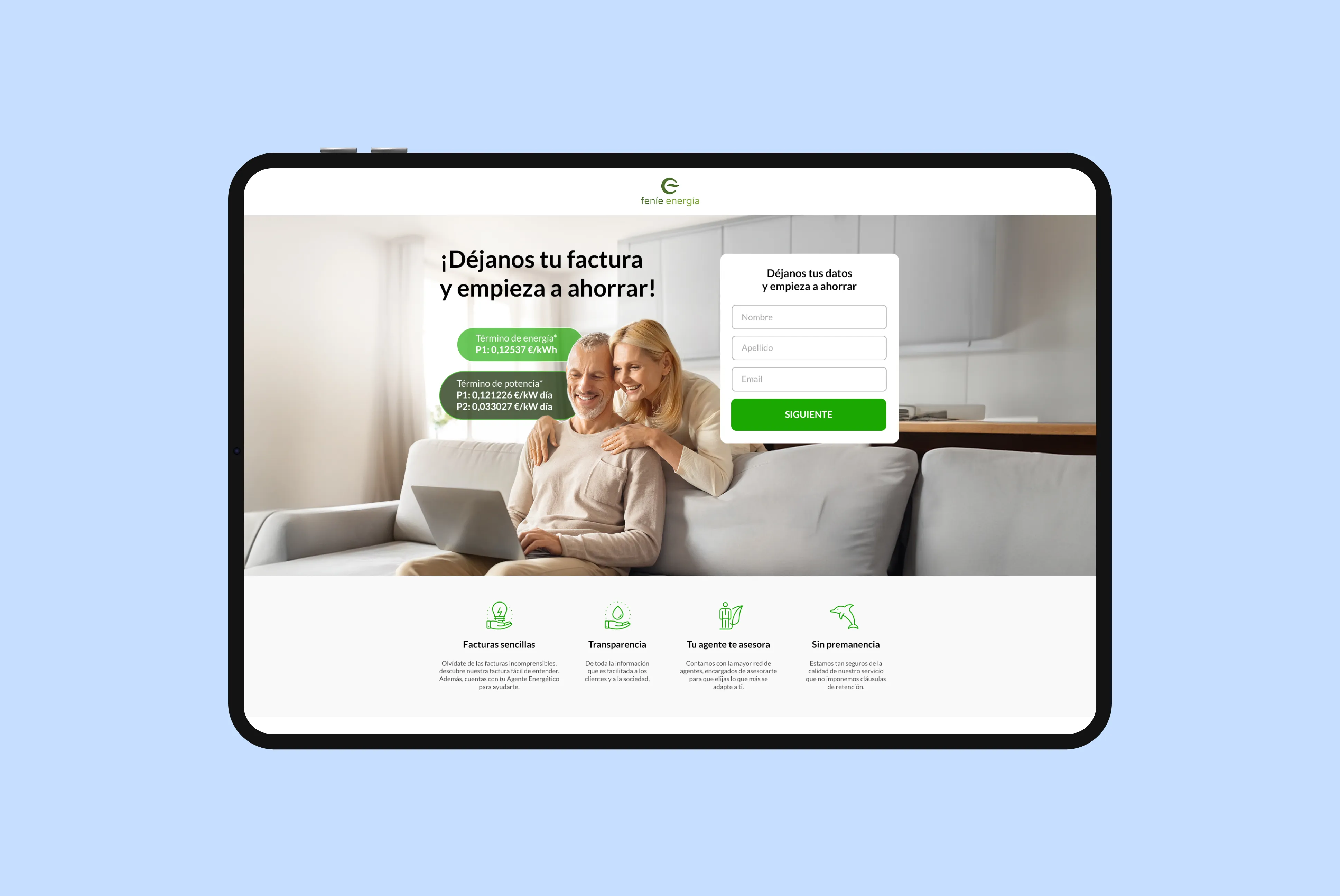 Smiling middle-aged couple using a laptop on a sofa with a sign-up form to submit energy bill details and start saving money from Fenie Energía.
