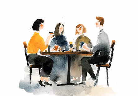 a group of people sitting at a table