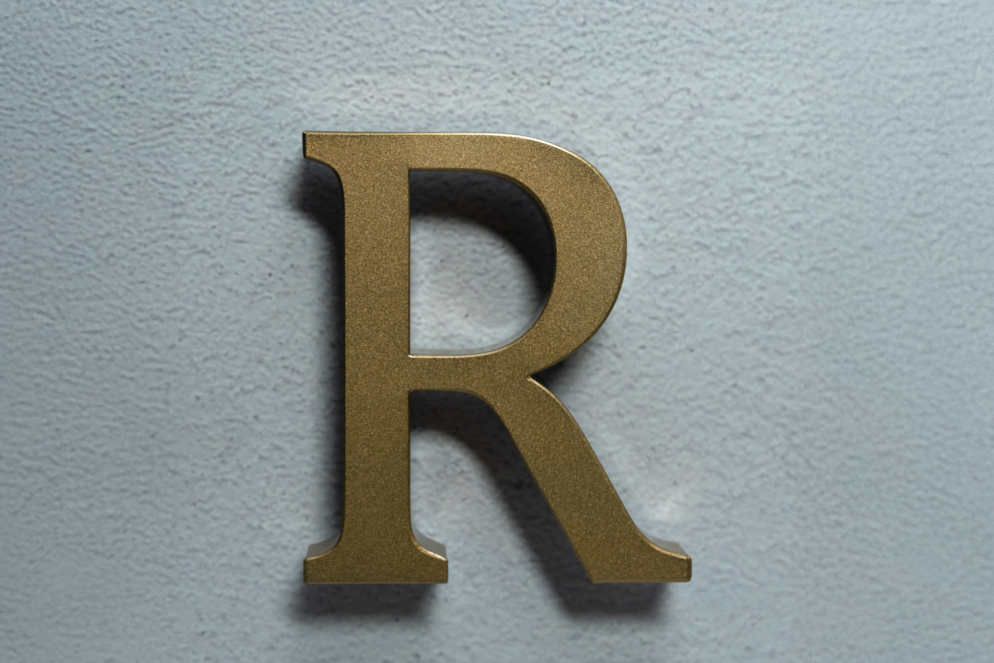 UH1 TruTrimless halo-lit channel letter with soft white backlight and aluminum finish-ON