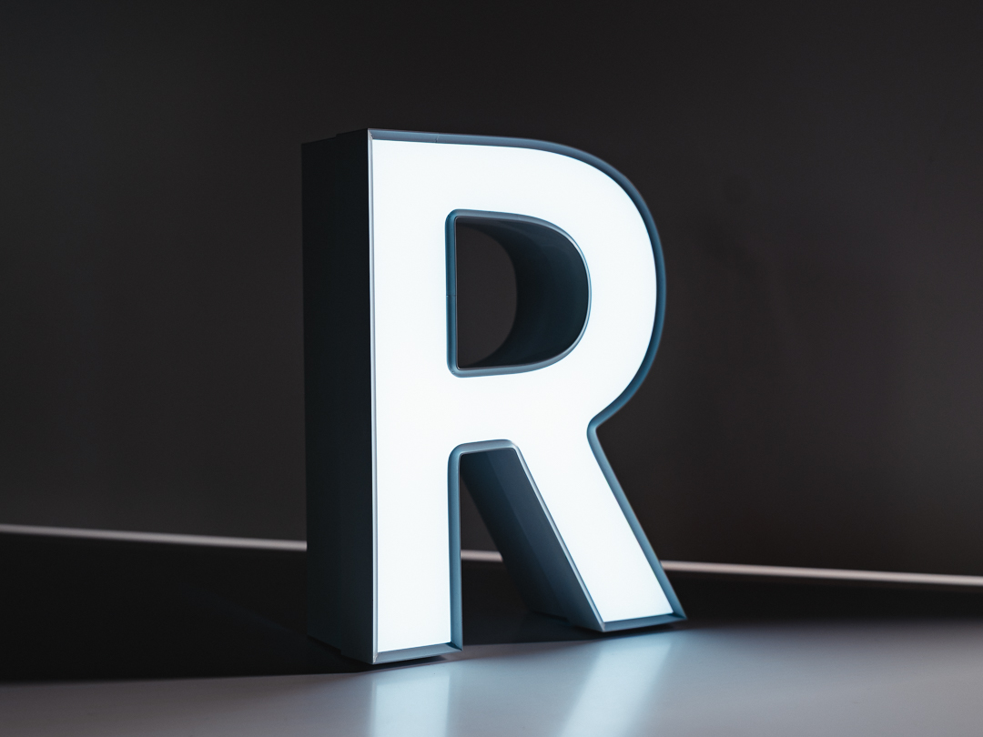 UT1 V-Trim face-lit channel letter with defined aluminum trimcap and bright white LED face.