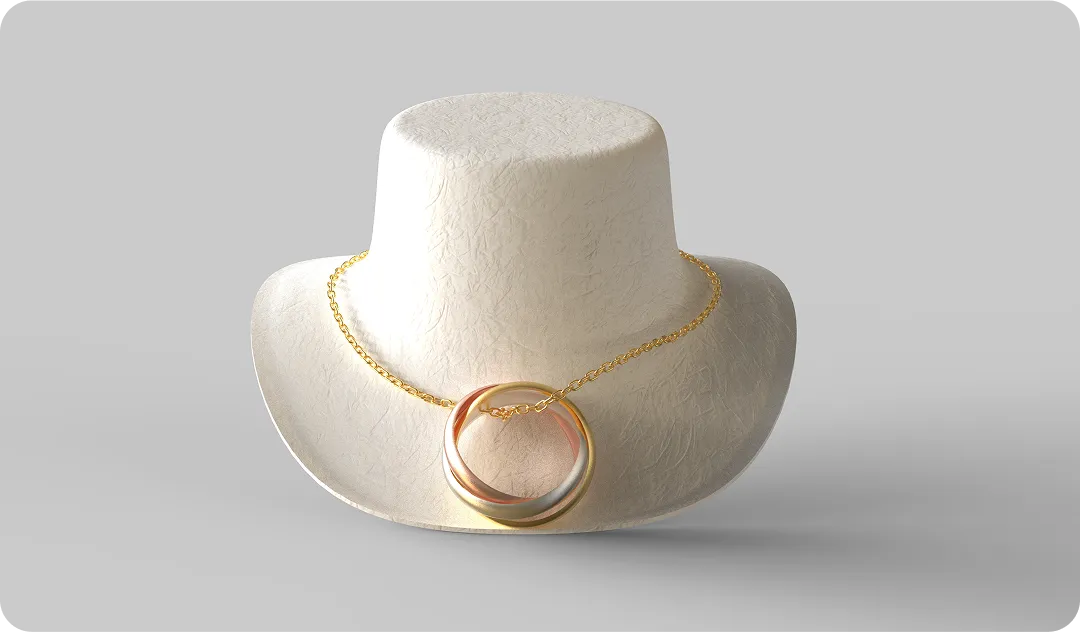 Eco-friendly molded fiber jewelry display stand featuring a gold necklace, showcasing sustainable and elegant packaging design by Nissha.