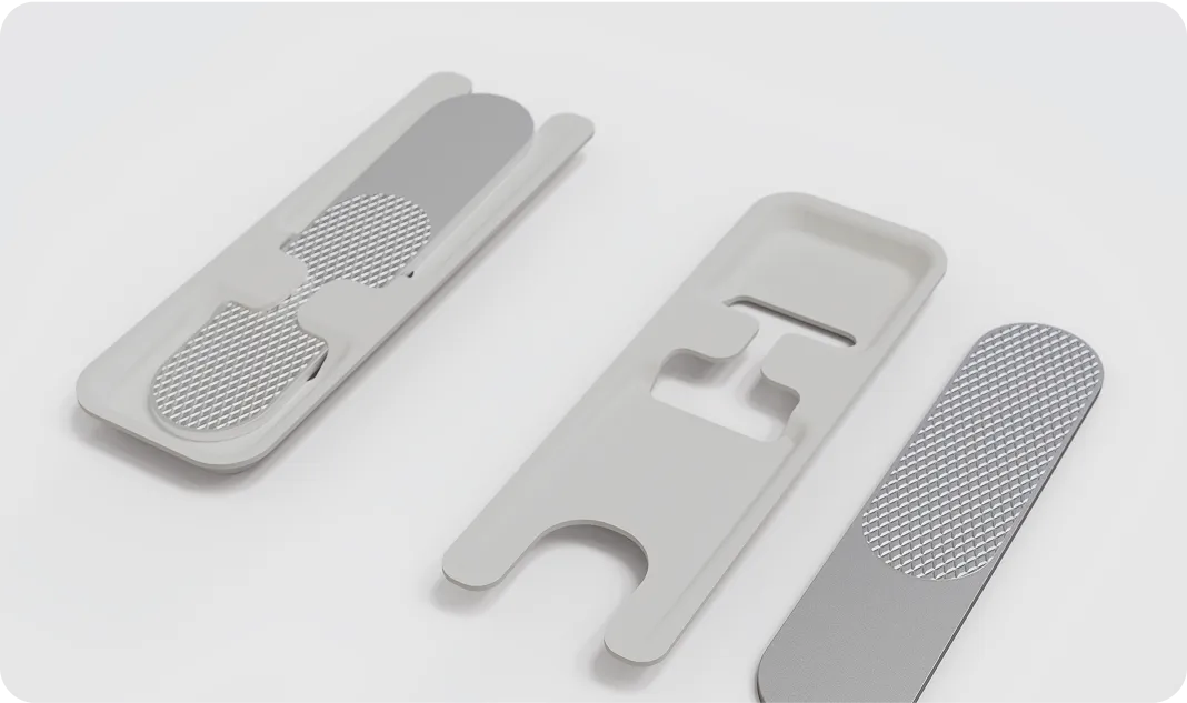 Sustainable molded fiber packaging with precision cutouts and textured inserts, combining recyclability with premium design by Nissha.