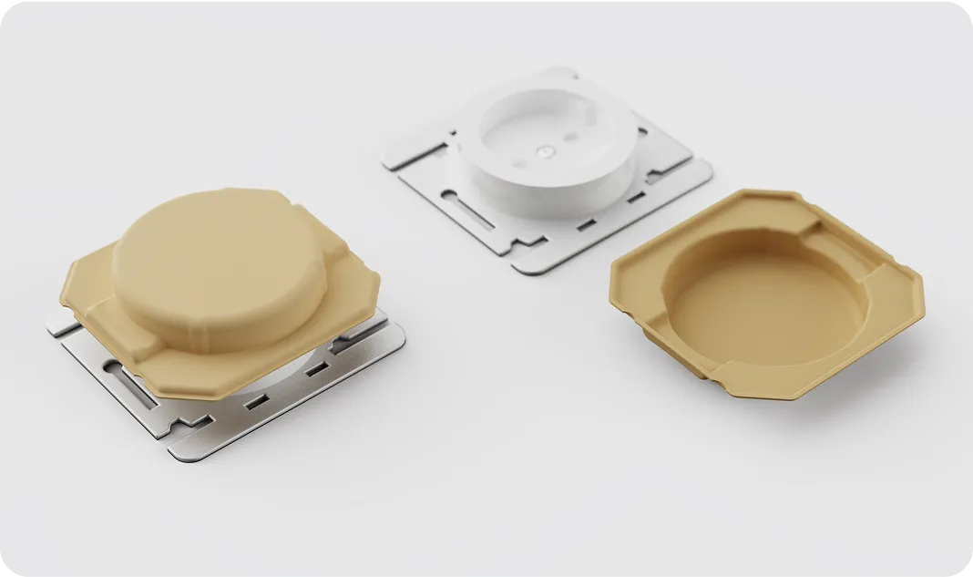 Sustainable molded fiber packaging trays in beige and white, recyclable and designed for product protection and premium presentation by Nissha.