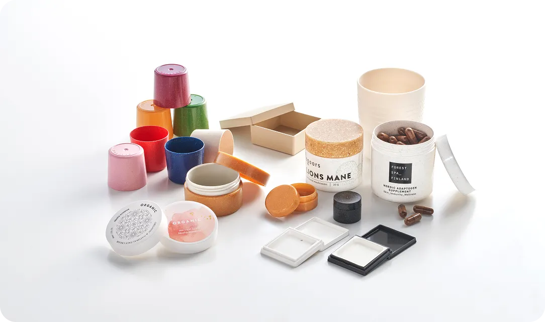 Assortment of eco-friendly packaging containers made from biodegradable materials, showcasing sustainable design solutions for cosmetics, supplements, and lifestyle products.
