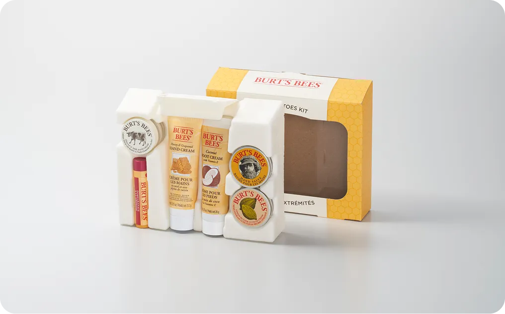Burt’s Bees natural skincare gift kit with eco-friendly molded fiber packaging and recyclable cardboard sleeve, showcasing sustainable cosmetic packaging design.
