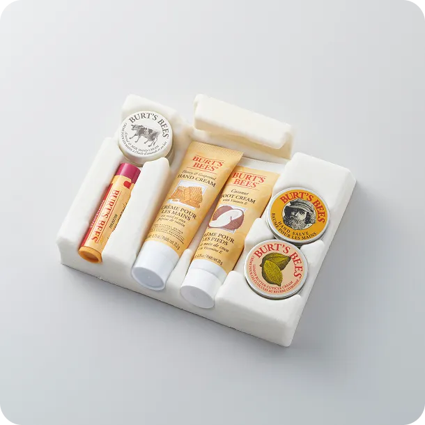 Burt’s Bees skincare set in a white molded fiber tray, showcasing eco-friendly sustainable packaging for natural beauty products.