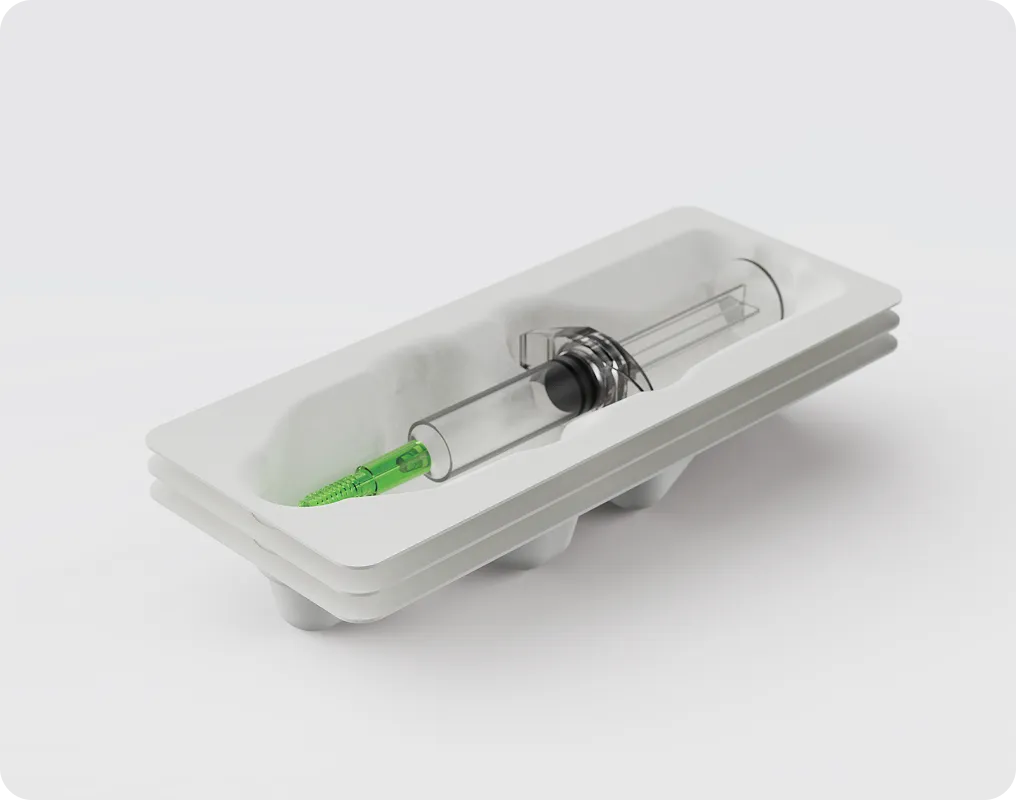 Eco-friendly molded fiber tray packaging holding a medical syringe, illustrating sustainable packaging solutions for healthcare and pharmaceutical applications.