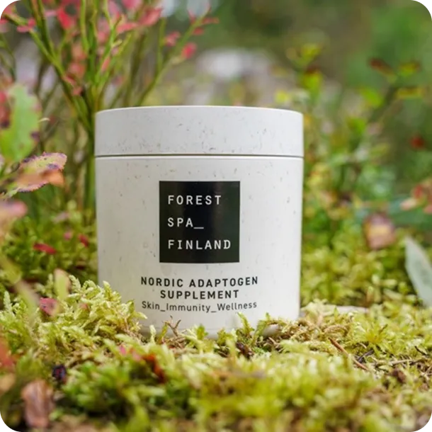 Forest Spa Finland Nordic Adaptogen Supplement eco-friendly jar placed in moss, symbolizing sustainable wellness and natural Scandinavian design.