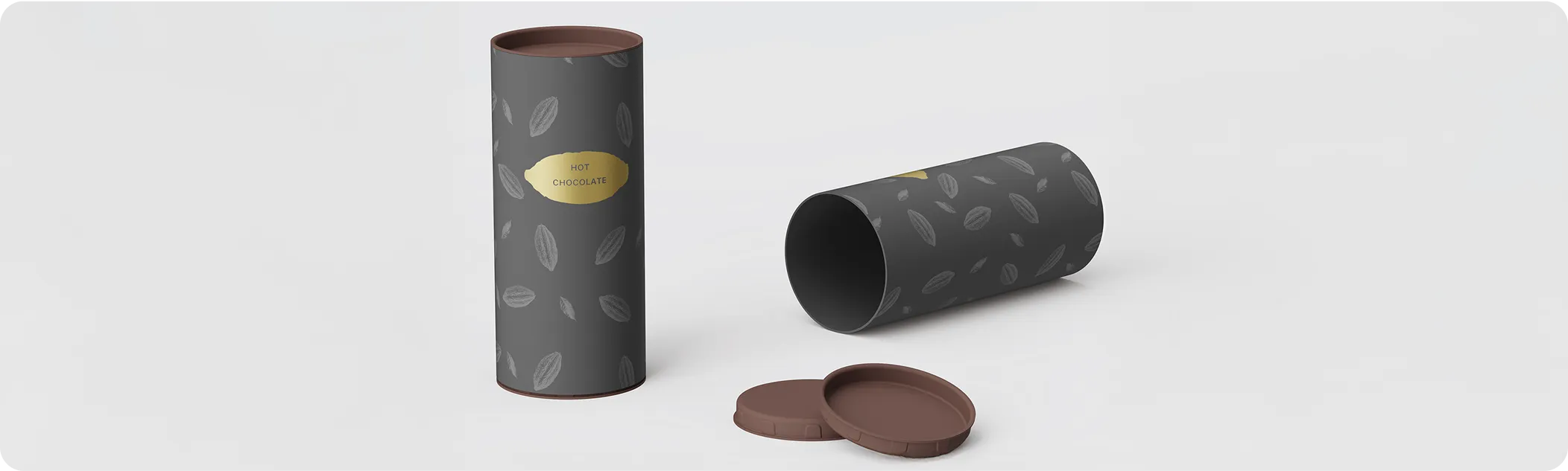 Elegant cylindrical hot chocolate packaging tubes in matte black with cocoa bean pattern and gold label, featuring sustainable brown lids on a light background.