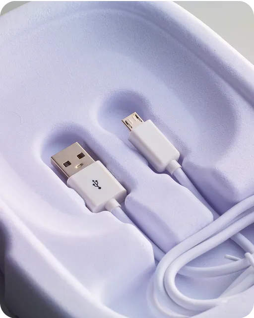 Close-up of sustainable molded fiber packaging made from recycled pulp, showing durable brown texture and protective structure for eco-friendly shipping.