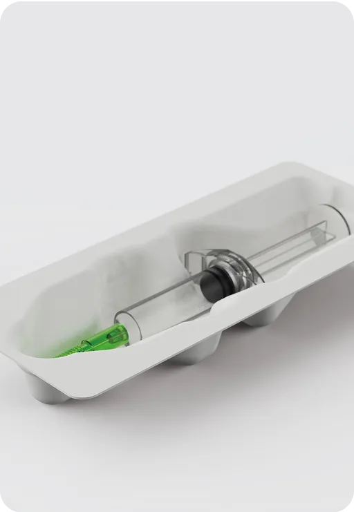 Eco-friendly molded fiber tray packaging a medical syringe, sustainable and plastic-free protective solution for healthcare products.