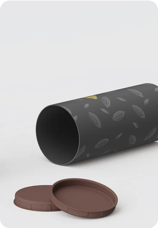 Black cylindrical paper tube with cocoa bean pattern and brown biodegradable lids, eco-friendly packaging design for chocolate or beverage products.