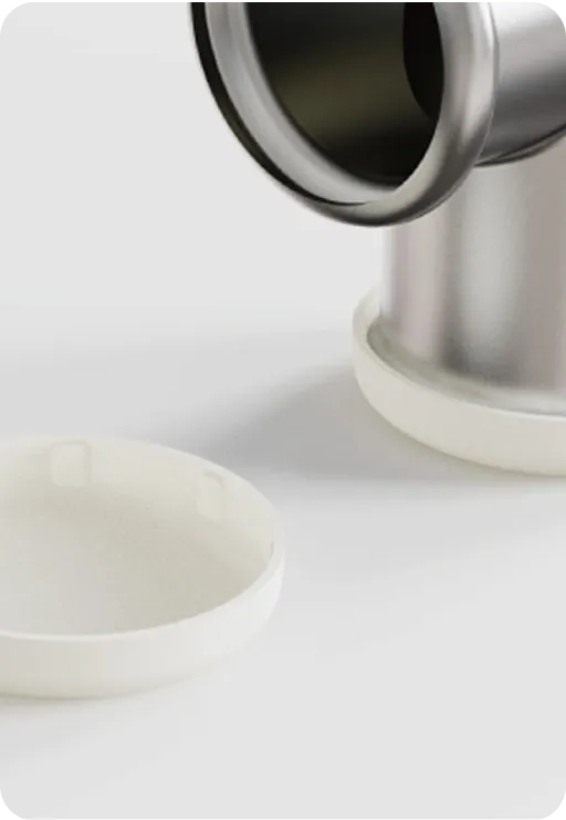 Eco-friendly metal container with biodegradable white lid, sustainable packaging solution combining durability and environmental responsibility.