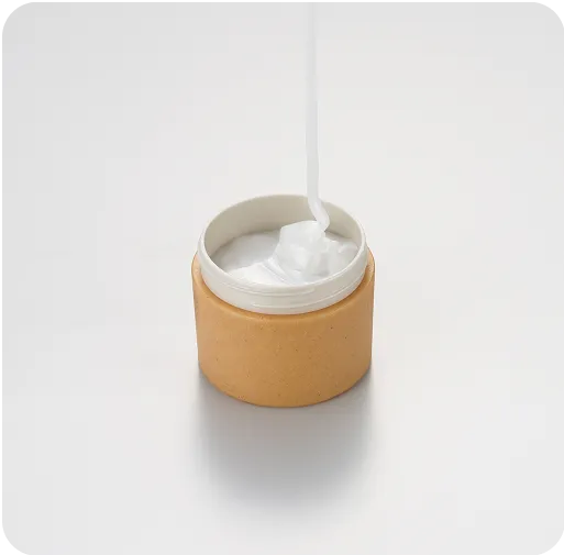 Eco-friendly biodegradable cosmetic jar with natural fiber packaging filled with white skincare cream, sustainable beauty container design.