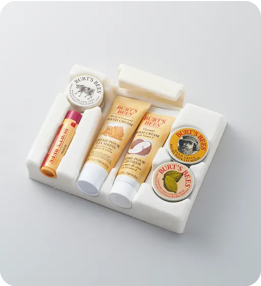 Burt’s Bees natural skincare gift kit with eco-friendly molded fiber packaging and recyclable cardboard sleeve, showcasing sustainable cosmetic packaging design.