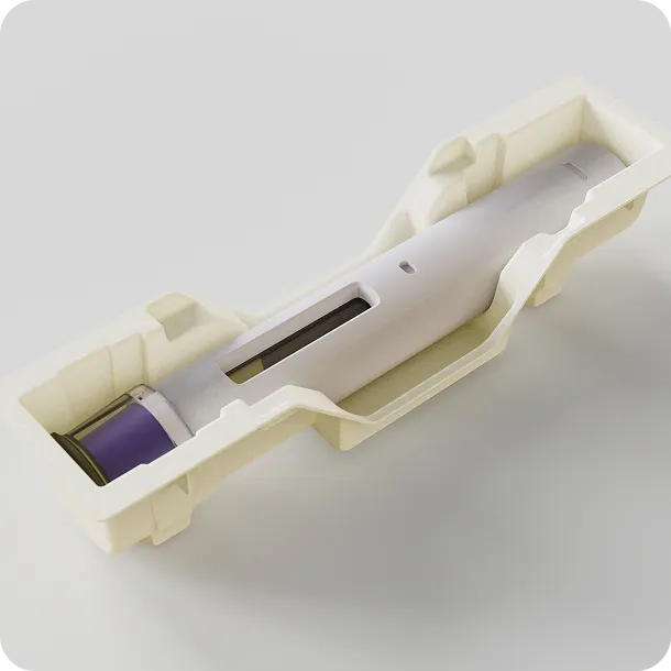 Stacked biodegradable molded fiber trays with pen-shaped medical devices, sustainable and plastic-free medical packaging solution.
