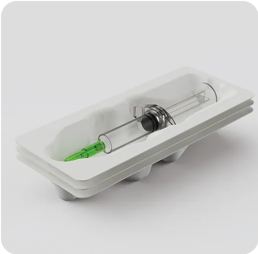 Eco-friendly molded fiber tray packaging a medical syringe, sustainable and plastic-free protective solution for healthcare products.