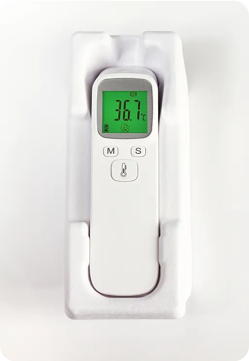 Digital thermometer in molded fiber protective packaging, highlighting sustainable and biodegradable design for medical device protection.