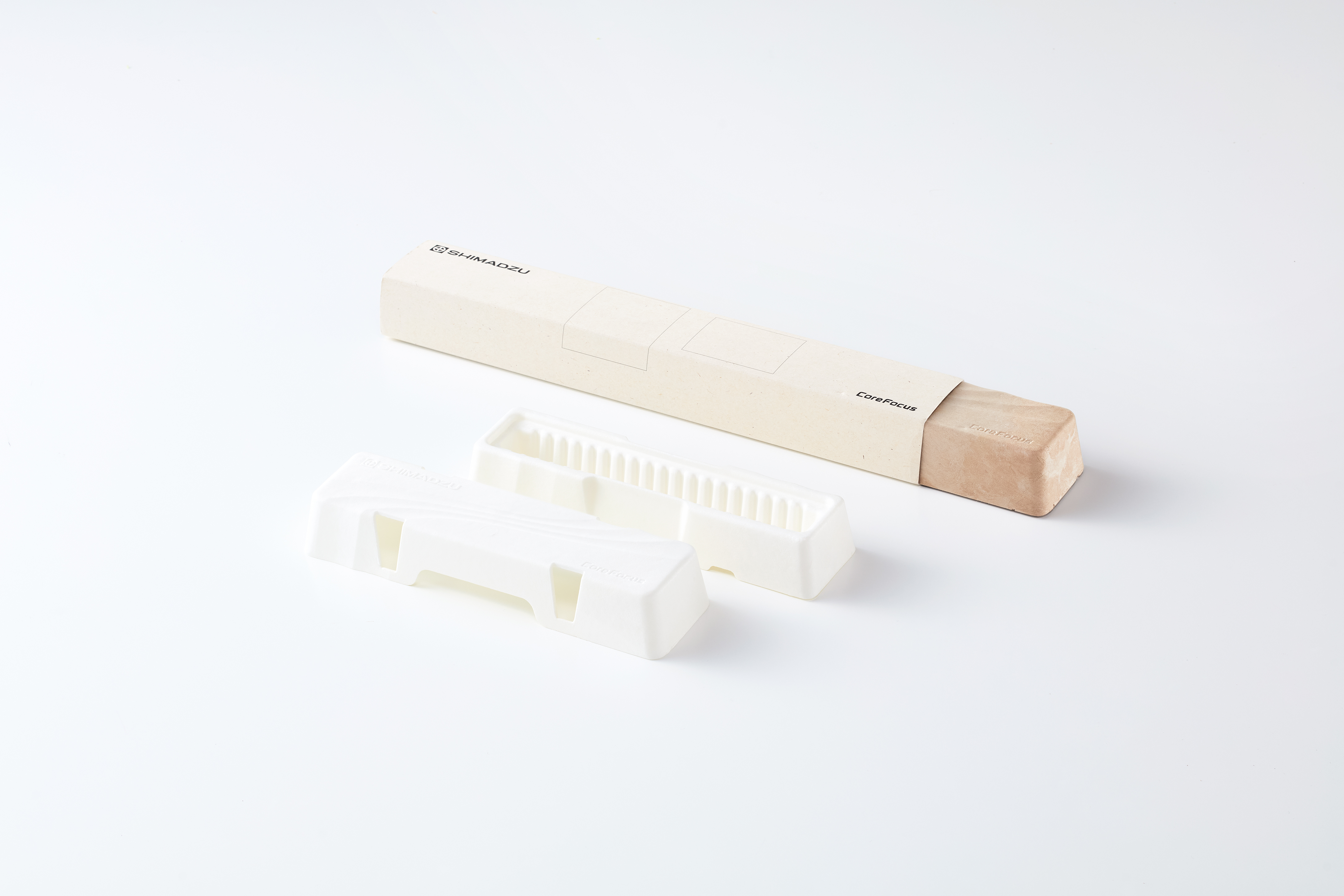 Eco-friendly molded fiber tray and packaging for Shimadzu CoreFocus analytical columns, showcasing sustainable laboratory packaging design.