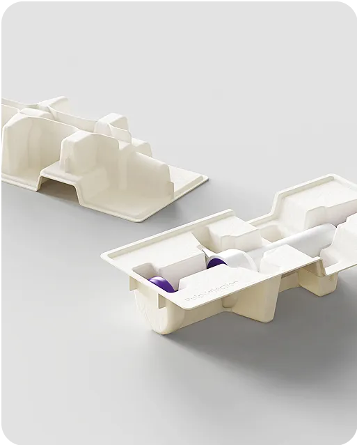 Eco-friendly molded fiber trays for secure vial and cartridge packaging, showcasing sustainable and protective industrial design.