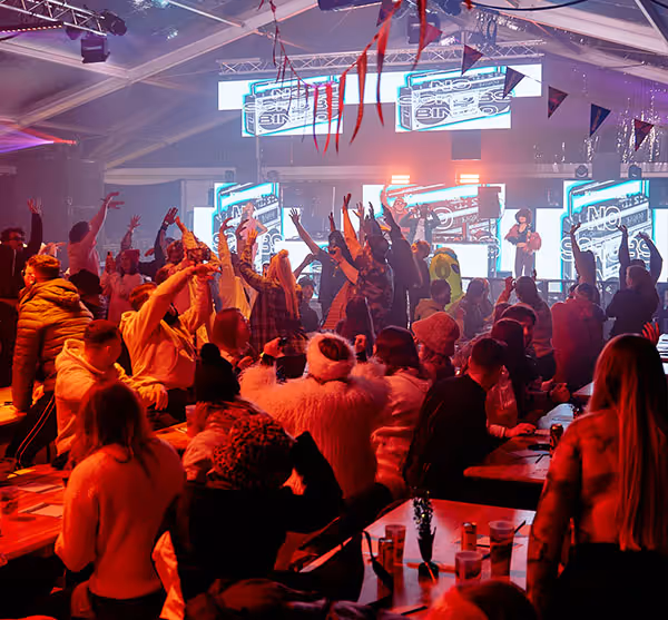 Group of people gathered having fun at a boozy bingo