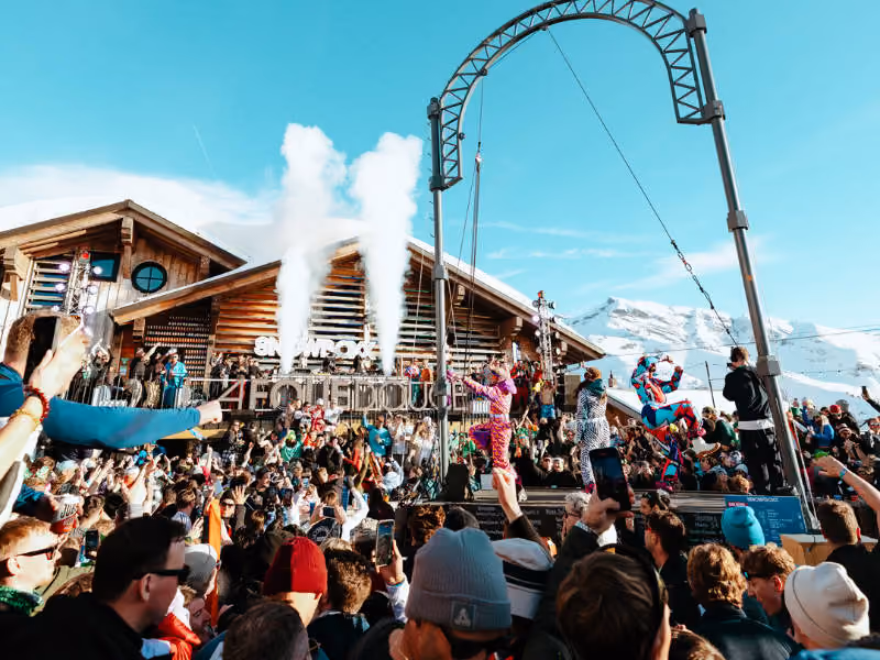 Artist Eats Everything performing in front of large crowd in the sunshine