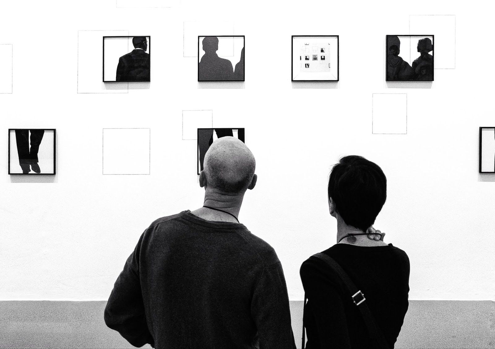 Art enthusiasts viewing limited editions