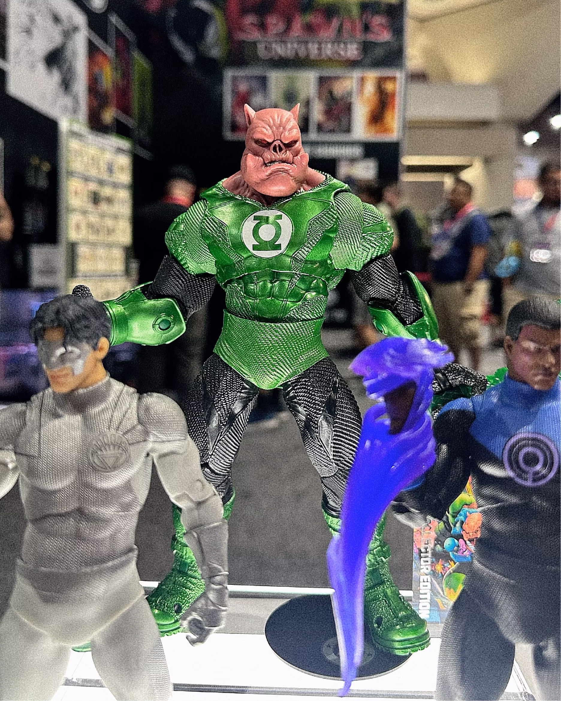 Green Lantern figures displayed side by side at the McFarlane Toys booth