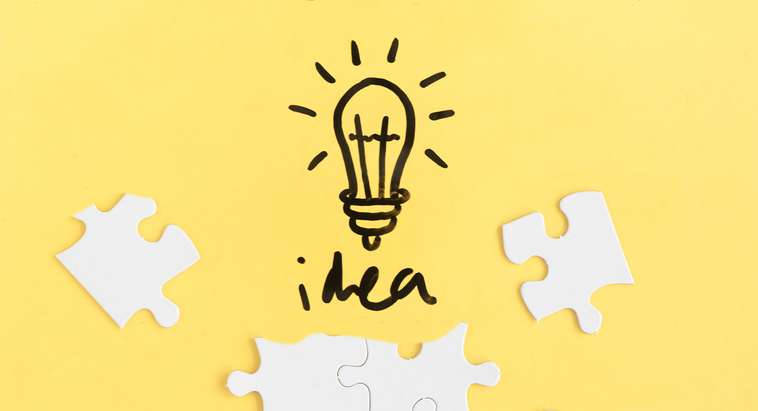 image puzzle pieces and hand drawn lightbulb