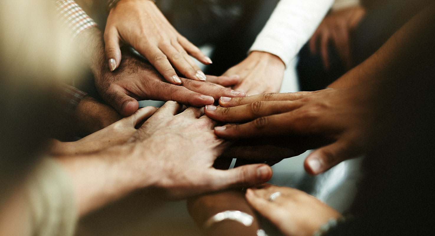 image of hands together as a team