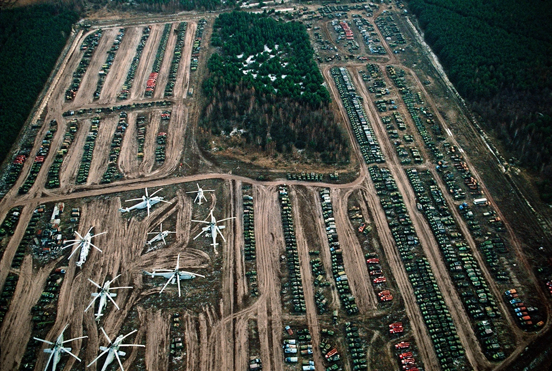 Thousands of contaminated vehicles, including helicopters, used in the clean-up await burial. © Gerd Ludwig, 1993