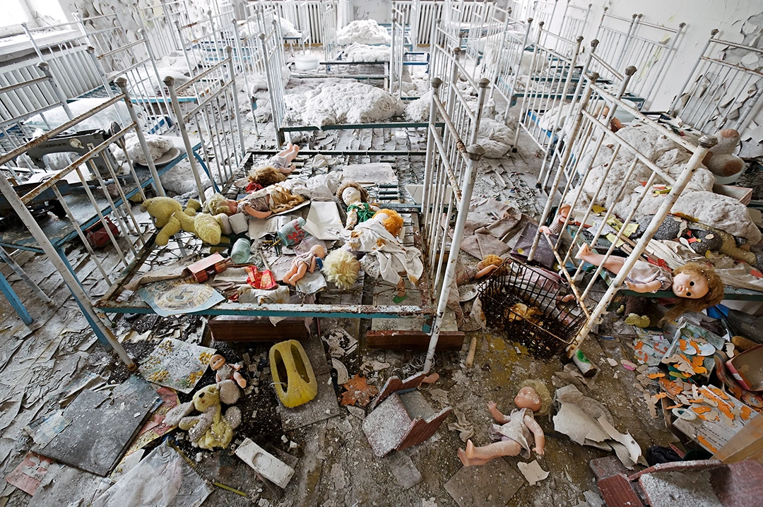 Dolls lie strewn on a nursery floor in Pripyat in 2005, left behind when the city was evacuated in 1986. © Gerd Ludwig, 1993