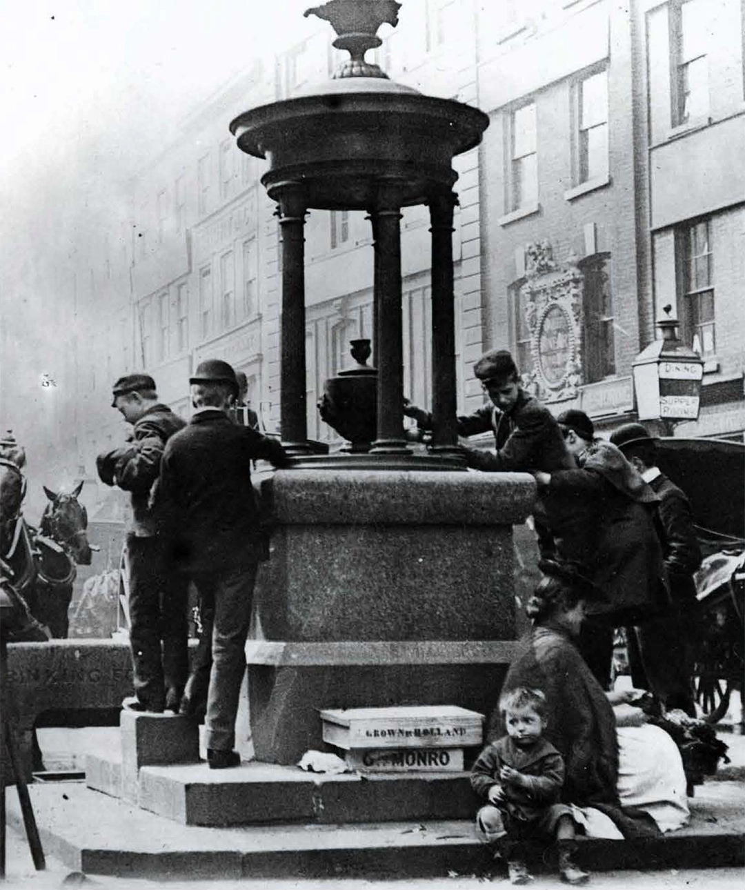 A hive of activity at a drinking fountain in Covent Garden, London, c 1890