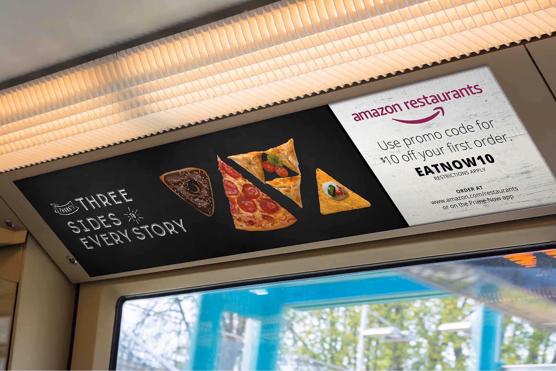 Overhead transit advertisement for Amazon Restaurants featuring pizza slices and a $10 off promo code EATNOW10.