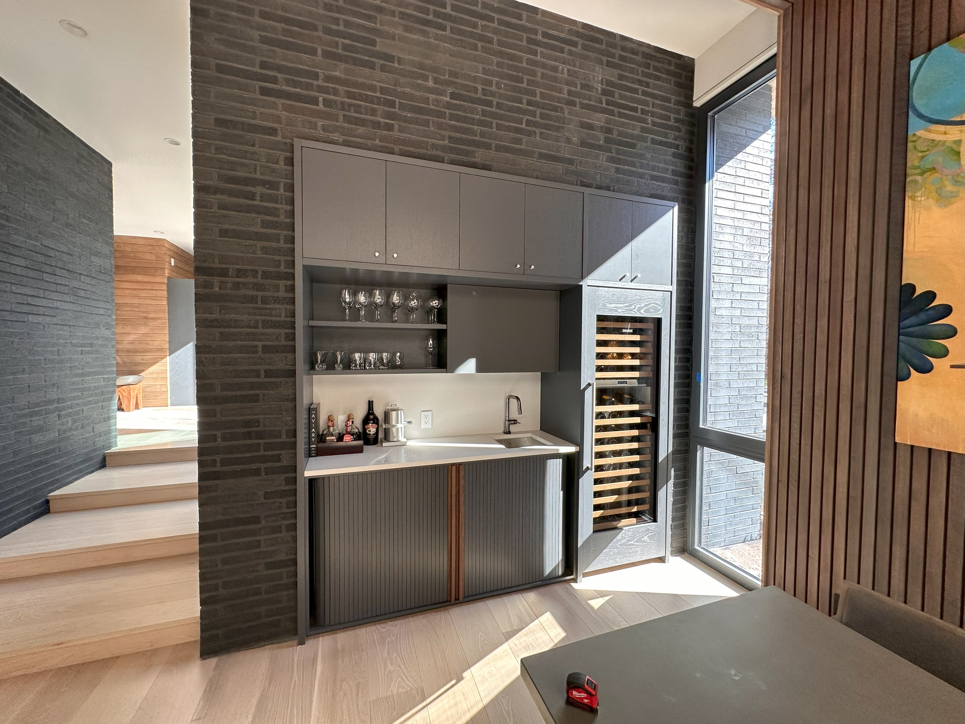Modern custom kitchen with dark cabinetry and island in Asheville, NC