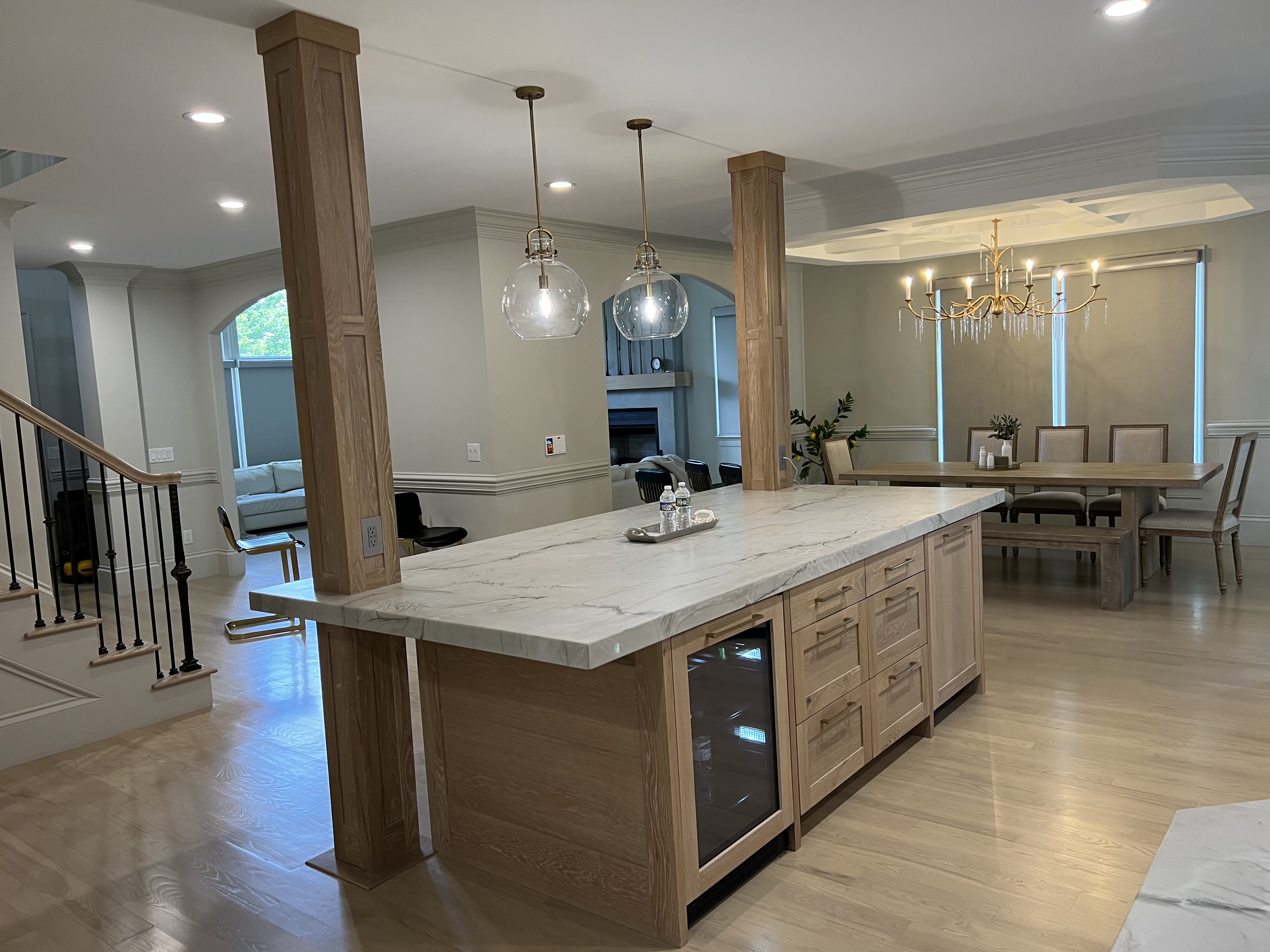White custom kitchen cabinets with brass hardware, range and refrigerator in Asheville NC