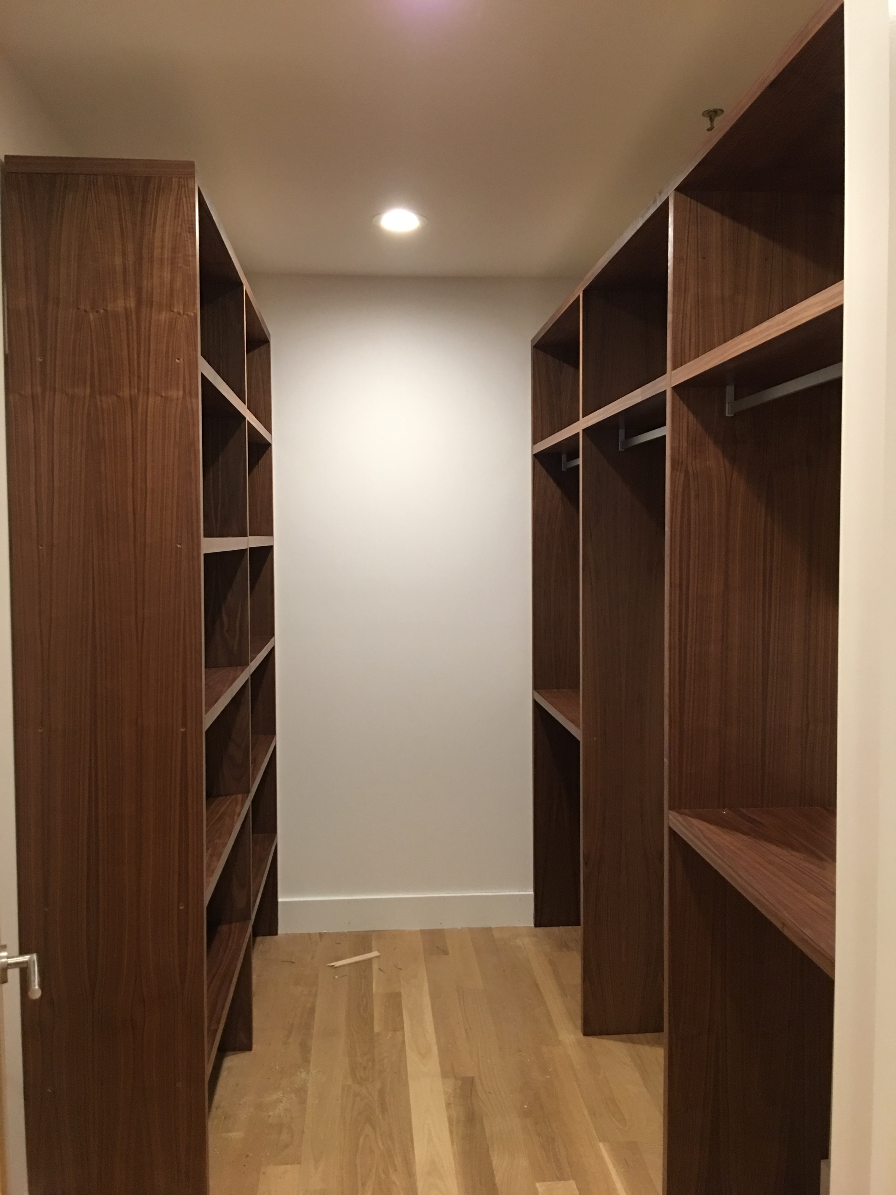 White custom kitchen cabinets with built-in oven and refrigerator in Asheville NC