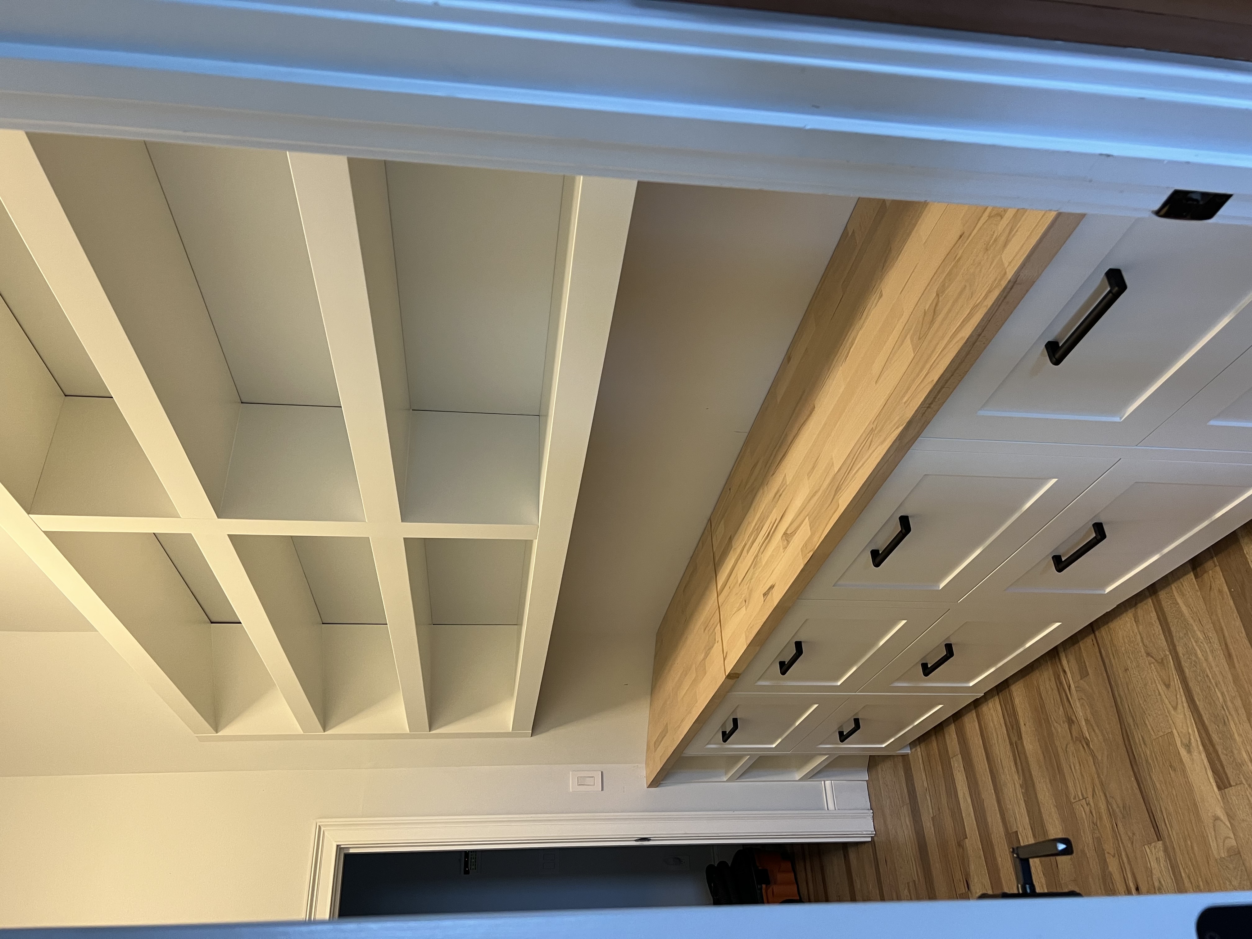 White custom kitchen cabinets with built-in oven and refrigerator in Asheville NC