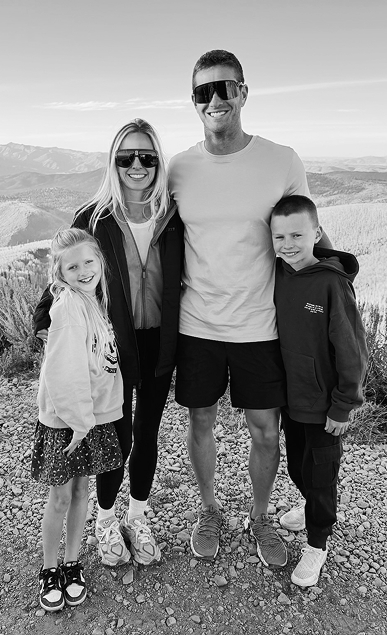 Cameron Bawden with his wife and two children, today