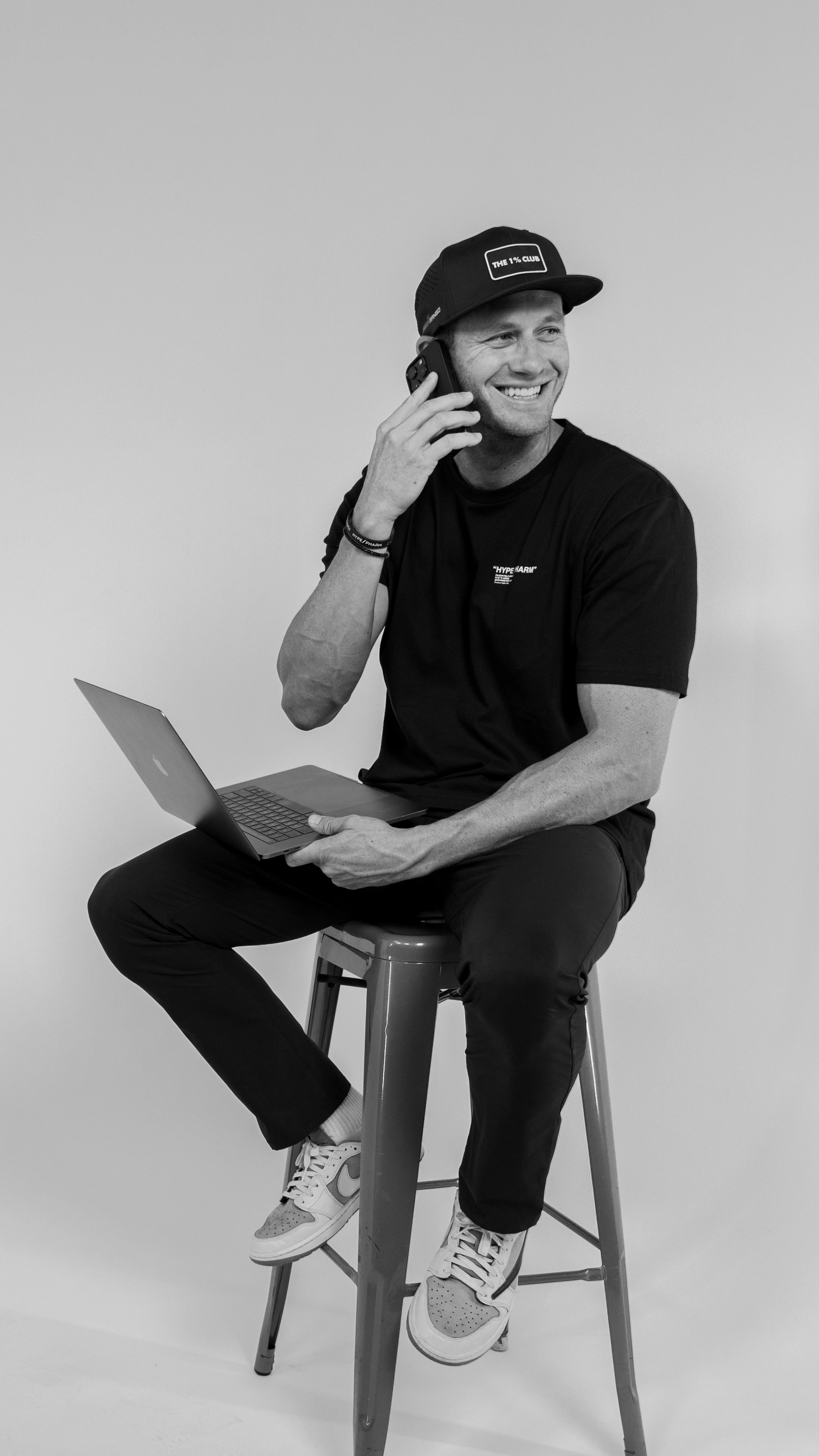 Cameron Bawden smiling while talking on the phone during a 1:1 mentorship session