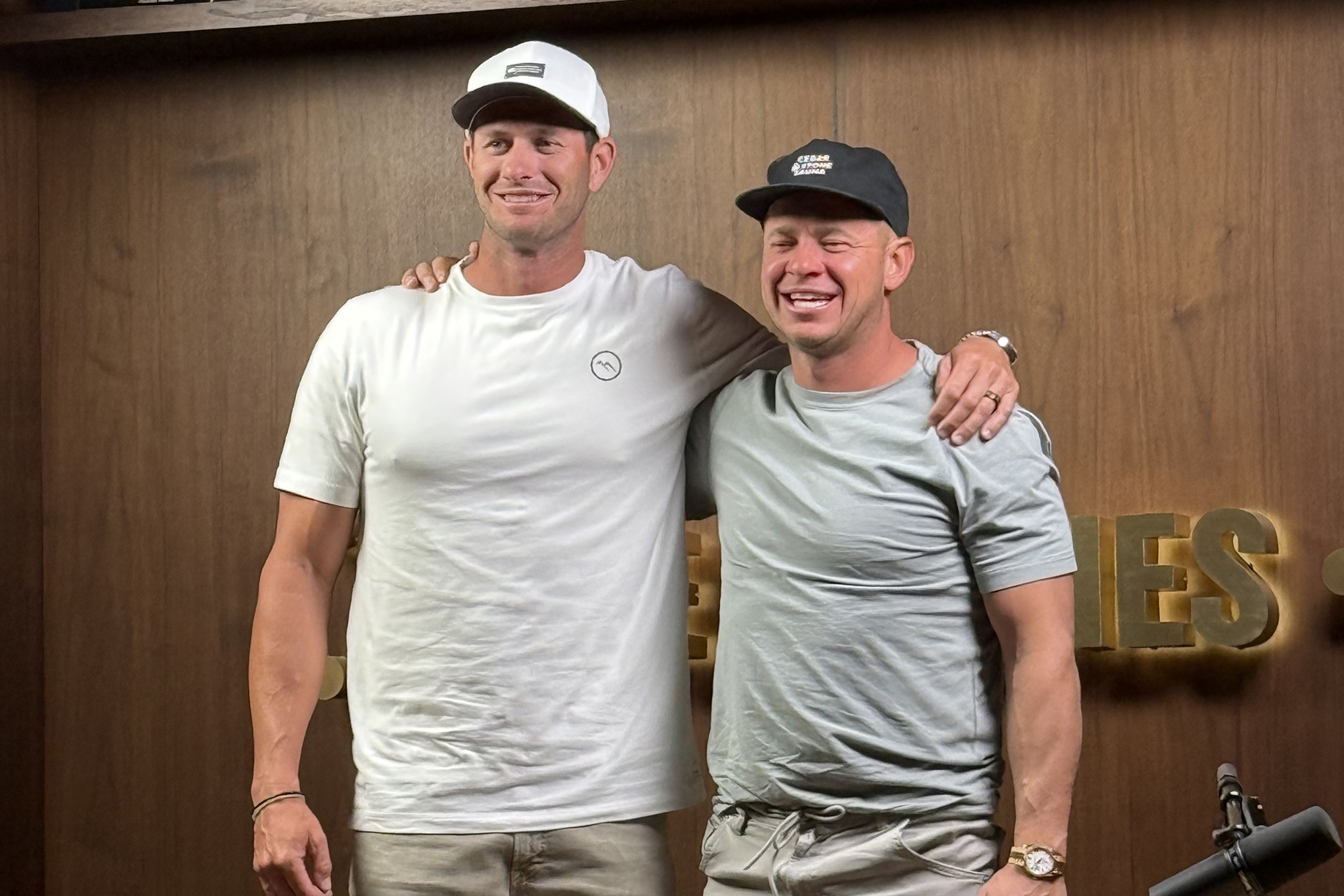 Cameron Bawden with a podcast host during an interview about entrepreneurship and leadership