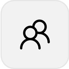 Icon of two overlapping user silhouettes representing a group or users.