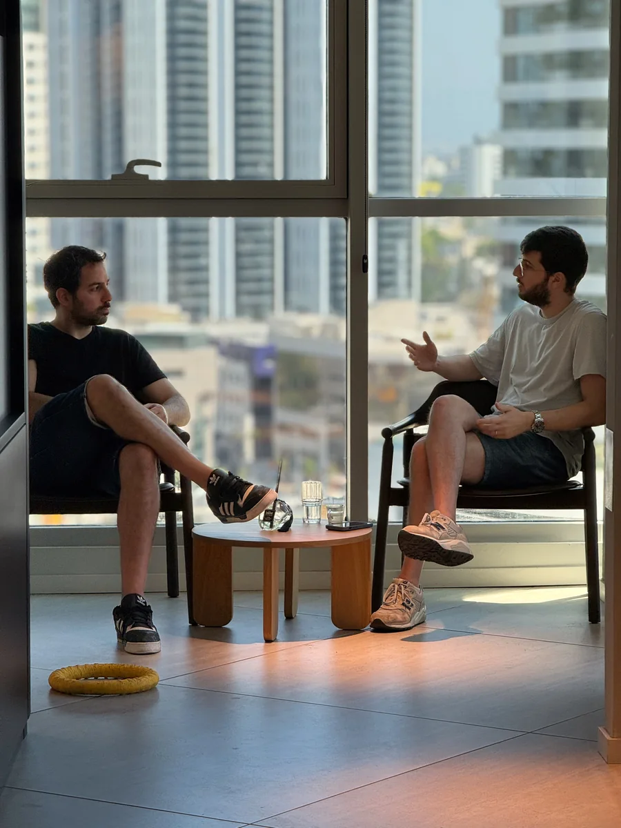 Two Ballerine team members in conversation by the window