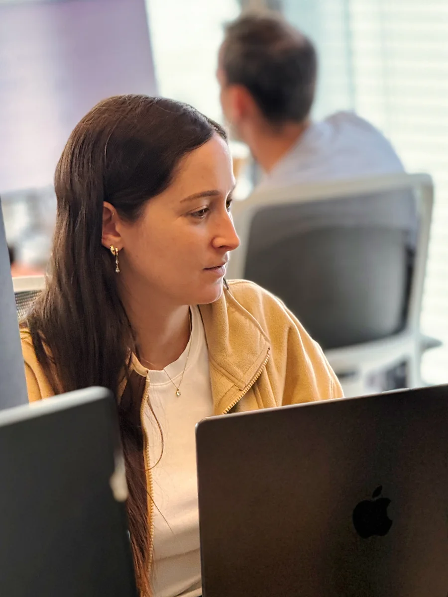 A Ballerine team member working at her desk