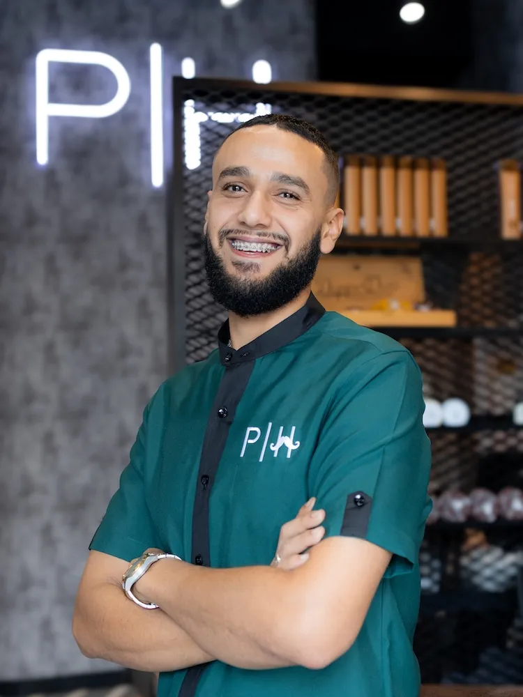 Hussein the Style Master barber specializing in all hair types at Dubai barbershop