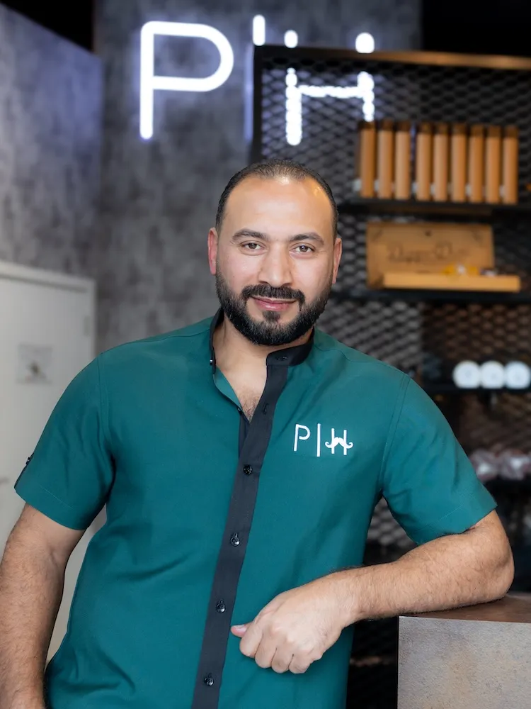 Hussein the Style Master barber specializing in all hair types at Dubai barbershop