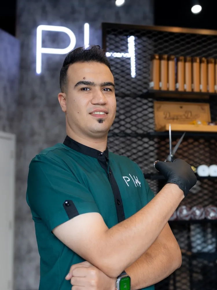 Hussein the Style Master barber specializing in all hair types at Dubai barbershop