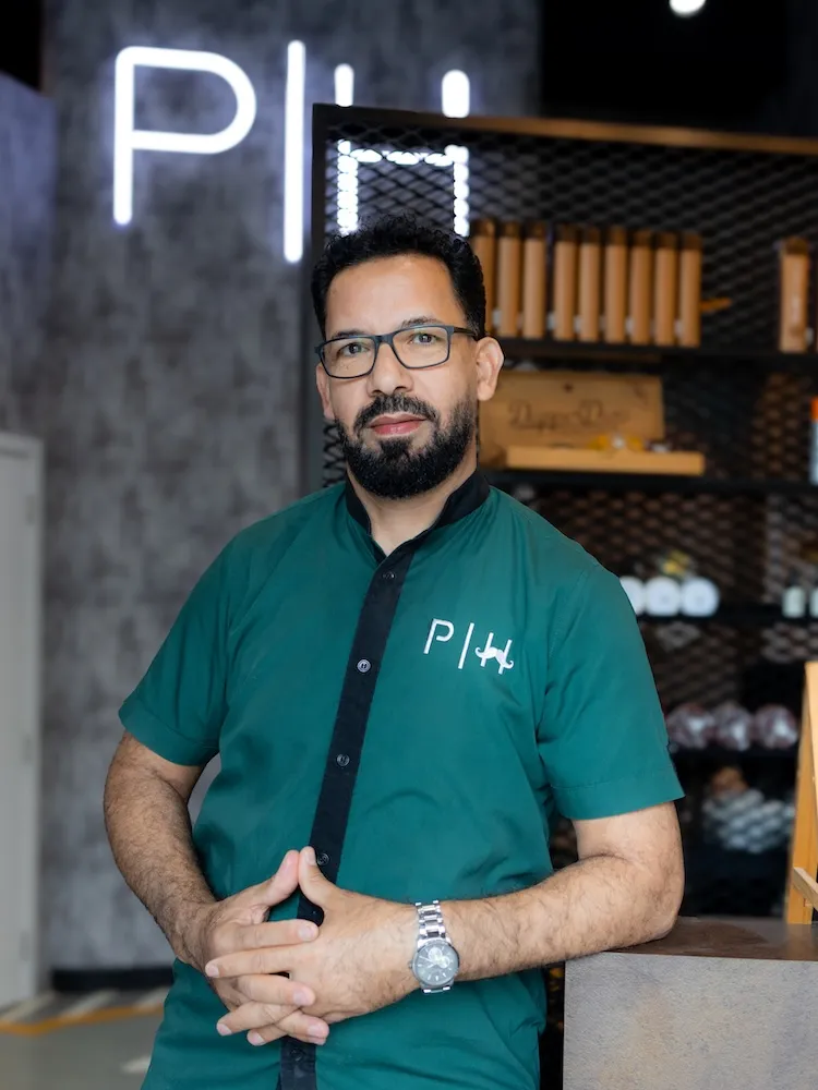 Hussein the Style Master barber specializing in all hair types at Dubai barbershop