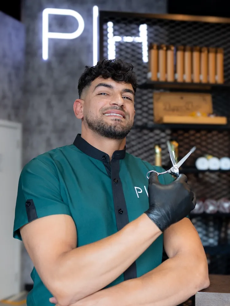 Hussein the Style Master barber specializing in all hair types at Dubai barbershop